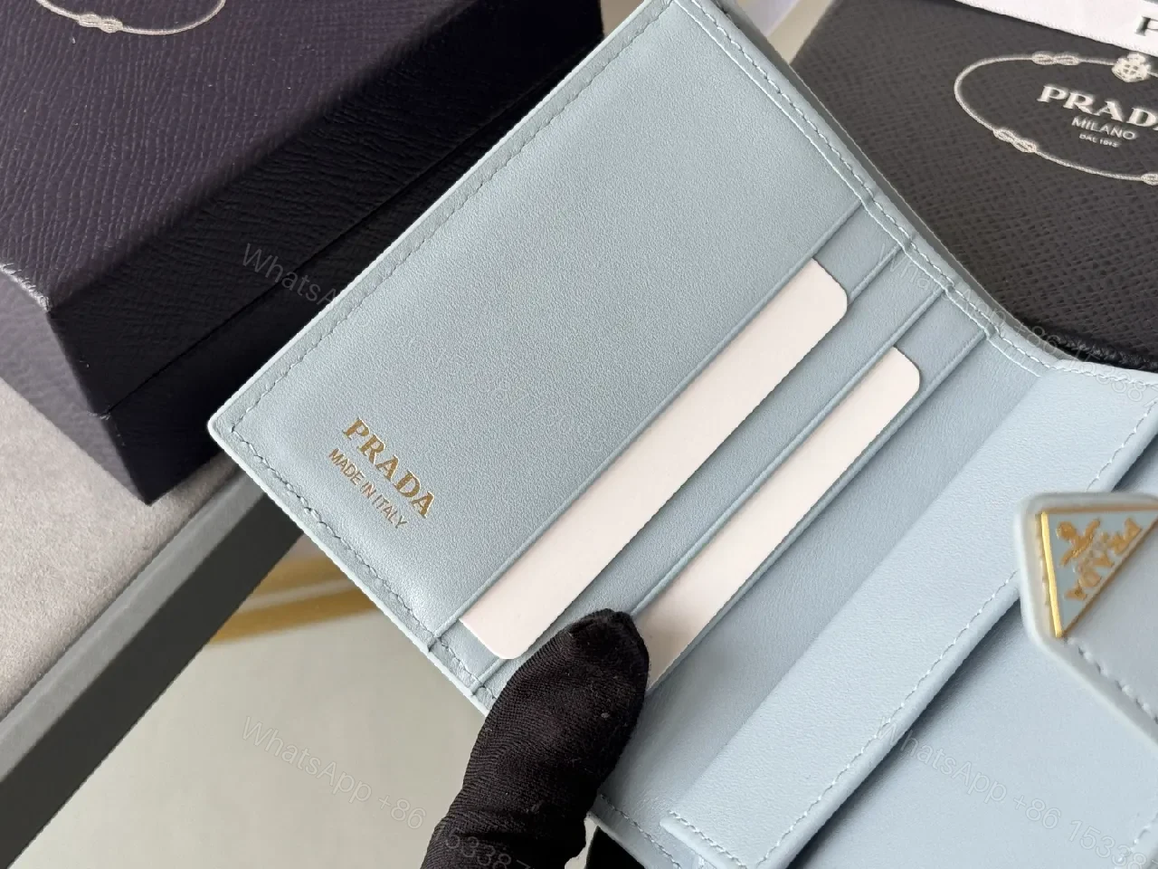 View 9 of Blue Saffiano-Like Bifold Wallet with Triangle Closure, Minimal Luxury