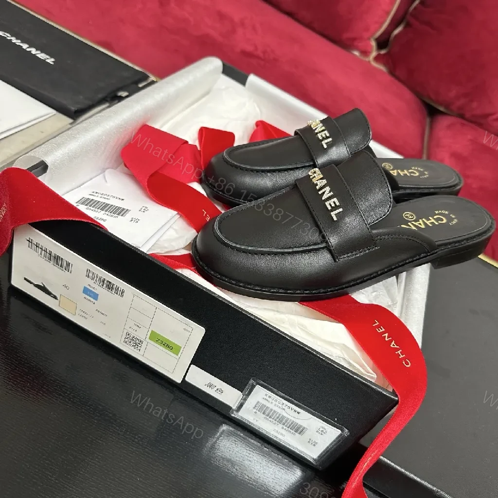 Black Leather Slip-Ons with Gold Lettering Luxury Everyday Comfort — view 1