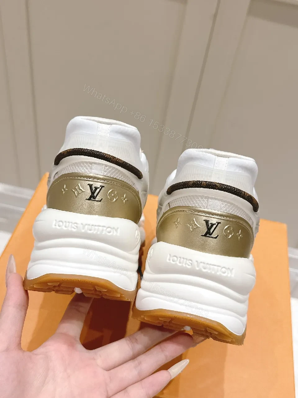 View 7 of Chunky White & Gold Luxe High-Tops: Signature LV Motif Sneakers