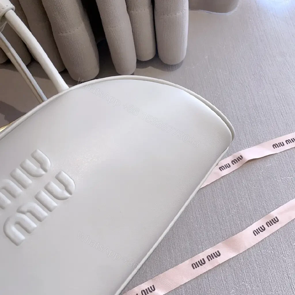 View 2 of Light Leather Dome Bag in Soft Hue, Compact Day-to-Night Carry