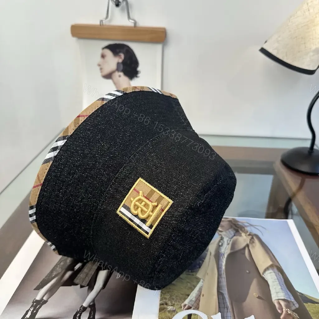 View 2 of Dark Black Denim Bucket Hat with Burberry-Style Band and Gold Emblem