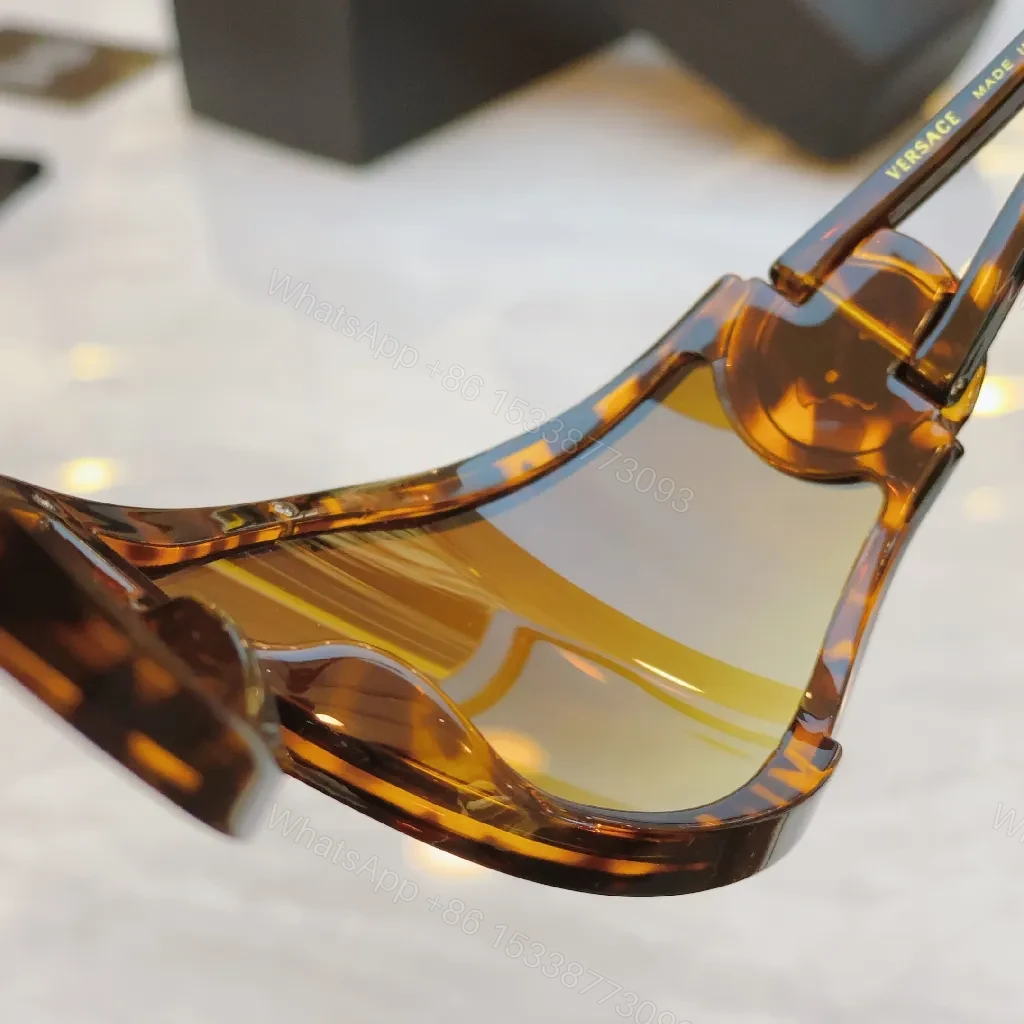 View 4 of Amber Frame Futuristic Sunglasses — Luxury UV Protection, Durable, Comfortable