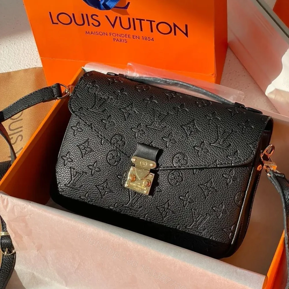 View 2 of Louis Vuitton Pochette Métis Monogram Empreinte Black 25Cm M41487