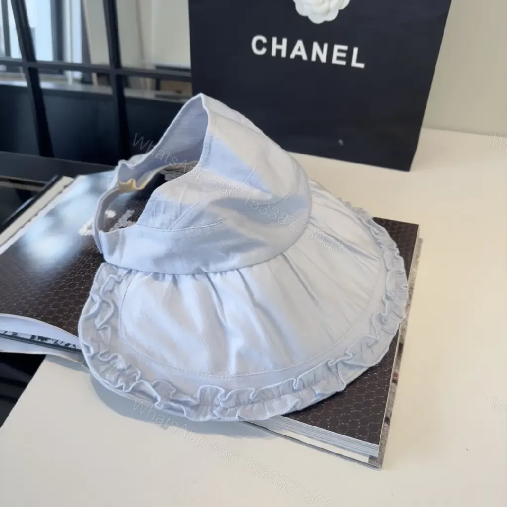 View 6 of Pastel Blue Floppy Hat with Ruffled Brim & Chanel Charm