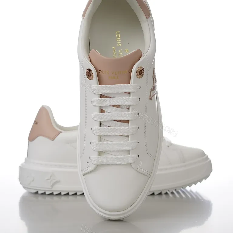 View 2 of Polished Everyday Comfort: White Leather Sneaker with Blush LV Accent