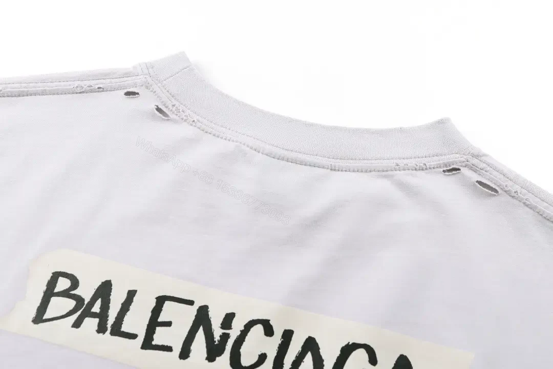 View 6 of Minimal White Cotton Tee: Subtle Logo, All-Day Comfort