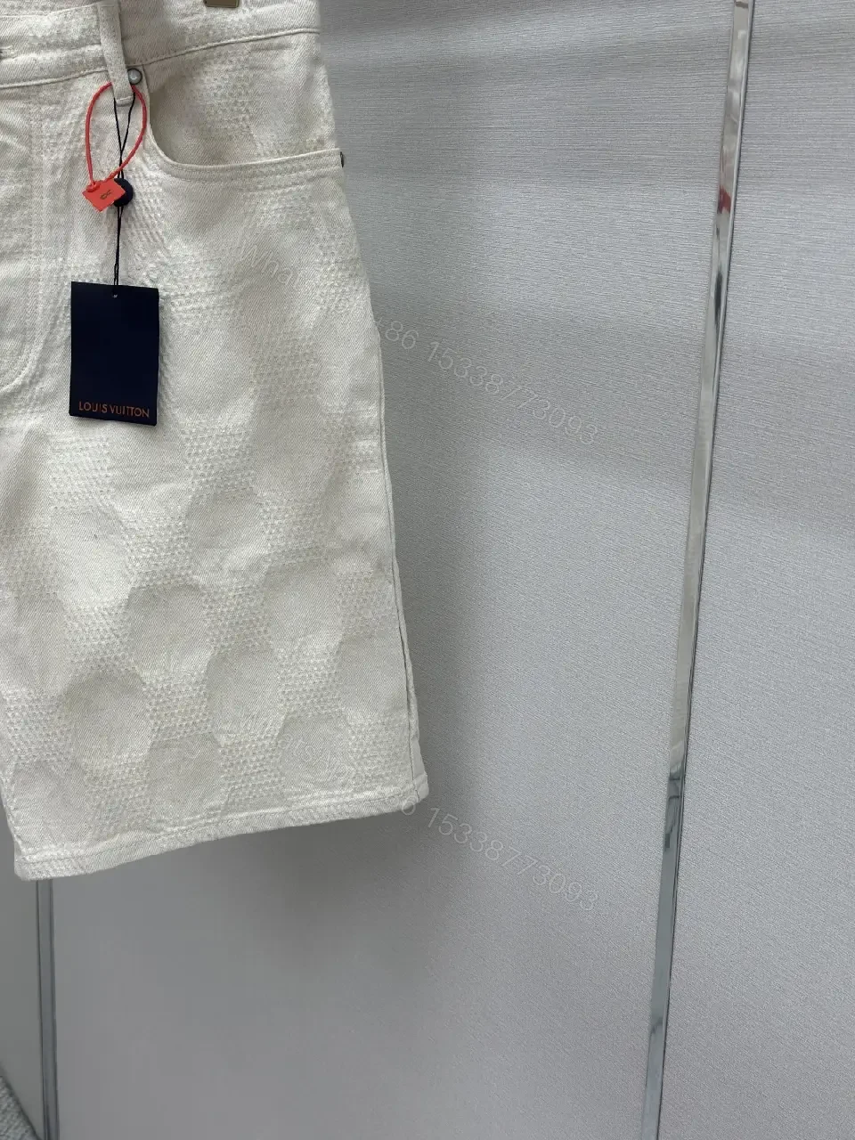 View 3 of Beige textured cotton-blend shorts with monogram-inspired print for everyday luxury