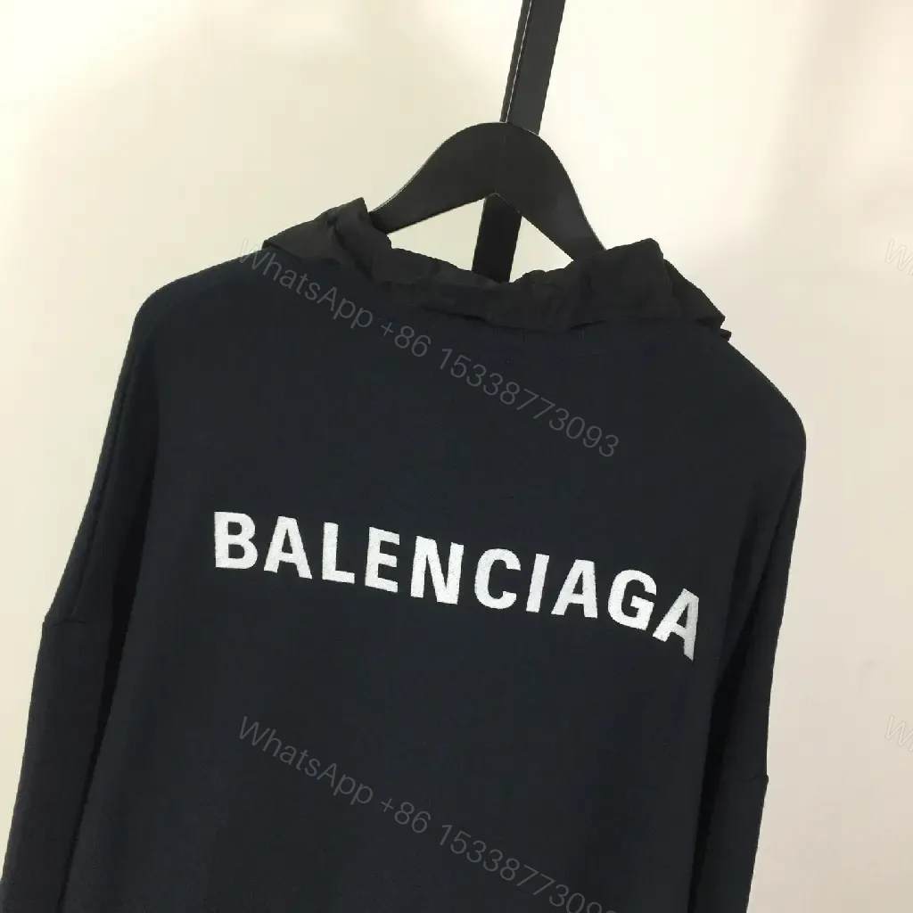 View 4 of Deep Black Hoodie: Minimalist Logo, Premium Knitwear, Relaxed Fit