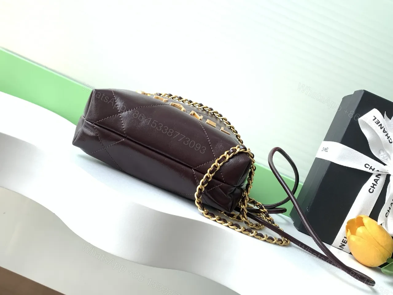 View 2 of Gold-Traced Quilted Bucket Bag: Luxury Leather, Iconic Hardware