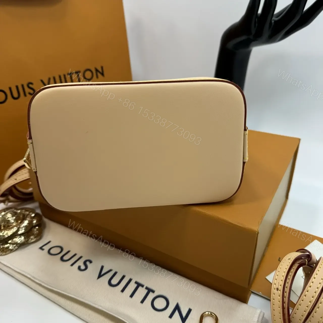 View 3 of Louis Vuitton Alma backpack in the signature brown monogram canvas