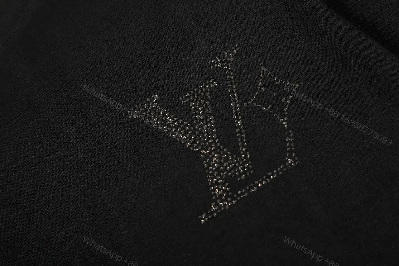 View 4 of Minimalist Black Cotton Tee with Subtle Monogram Detail - Everyday Luxury