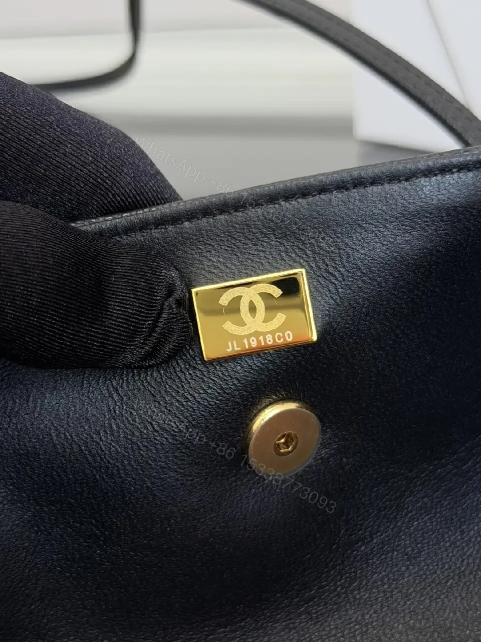 View 6 of Black Grain Leather Crossbody Bag – Gold Twist, Compact & Versatile