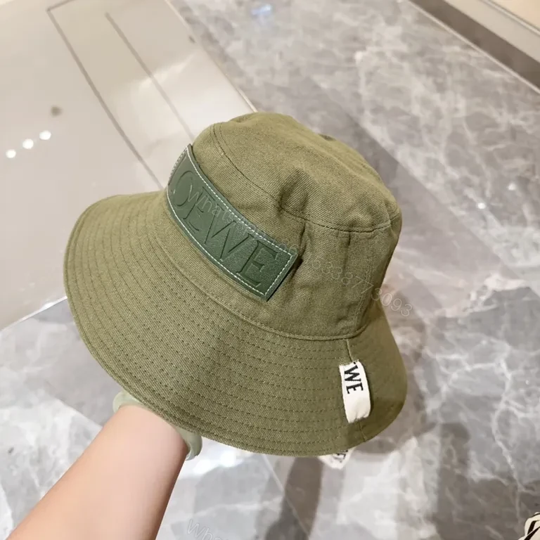 View 5 of Olive Canvas Bucket Hat: Subtle Luxury, LOEWE Patch
