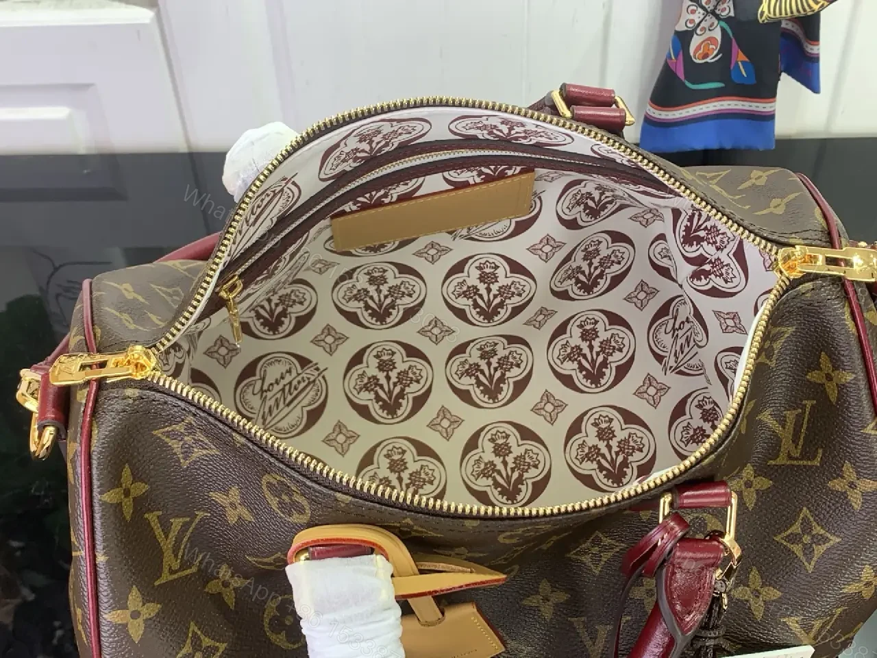 View 10 of Brown Canvas LV Monogram Travel Handbag with Burgundy Leather Trim