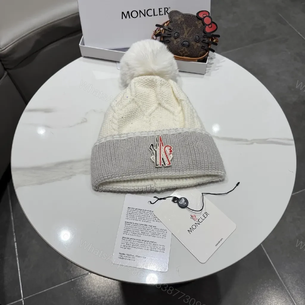 Chic Winter Knit Beanie with Plush Pom and Moncler Accent — view 1