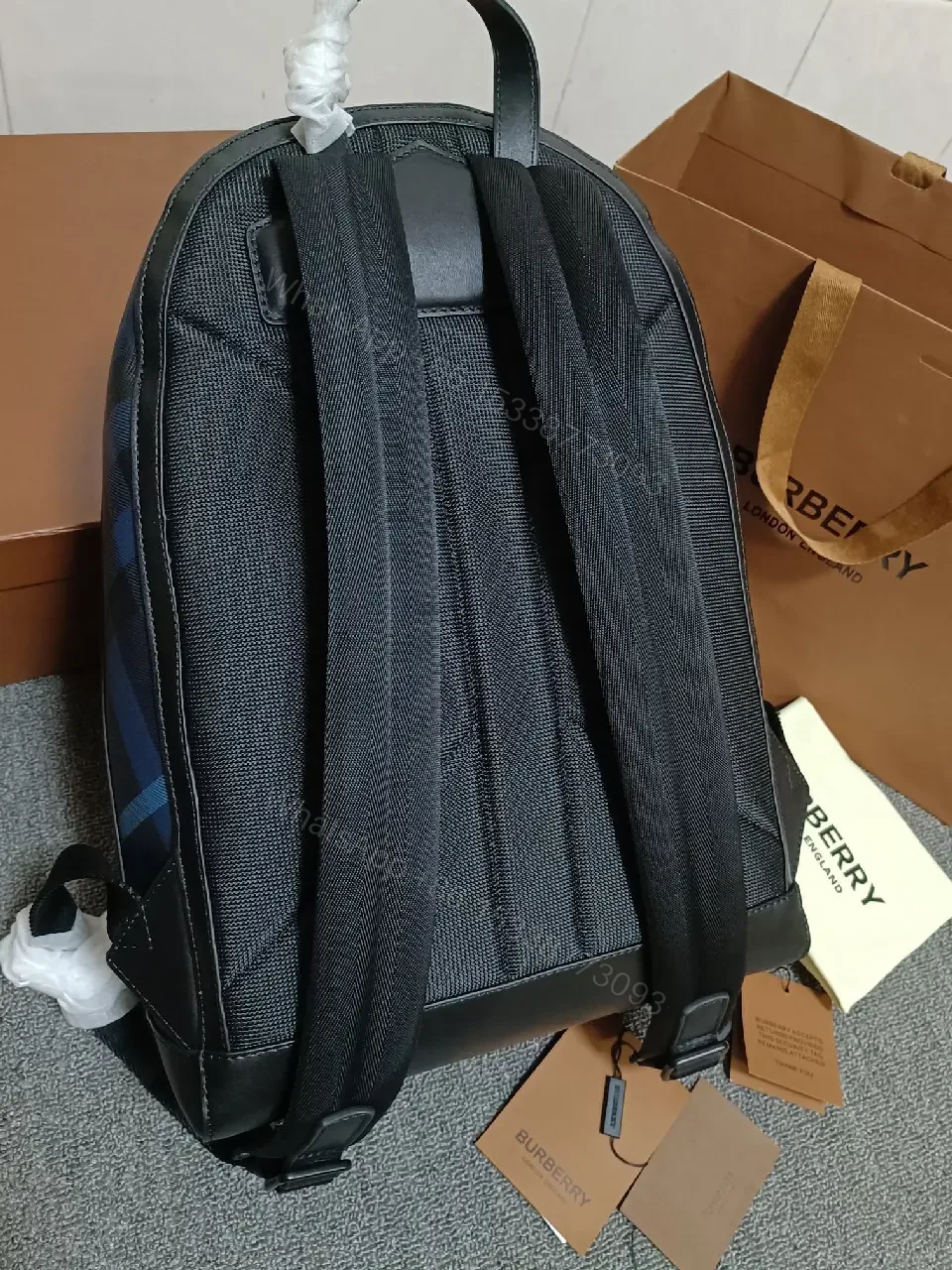 View 2 of Bold Check Pattern Leather-Accented Backpack for Everyday Luxury