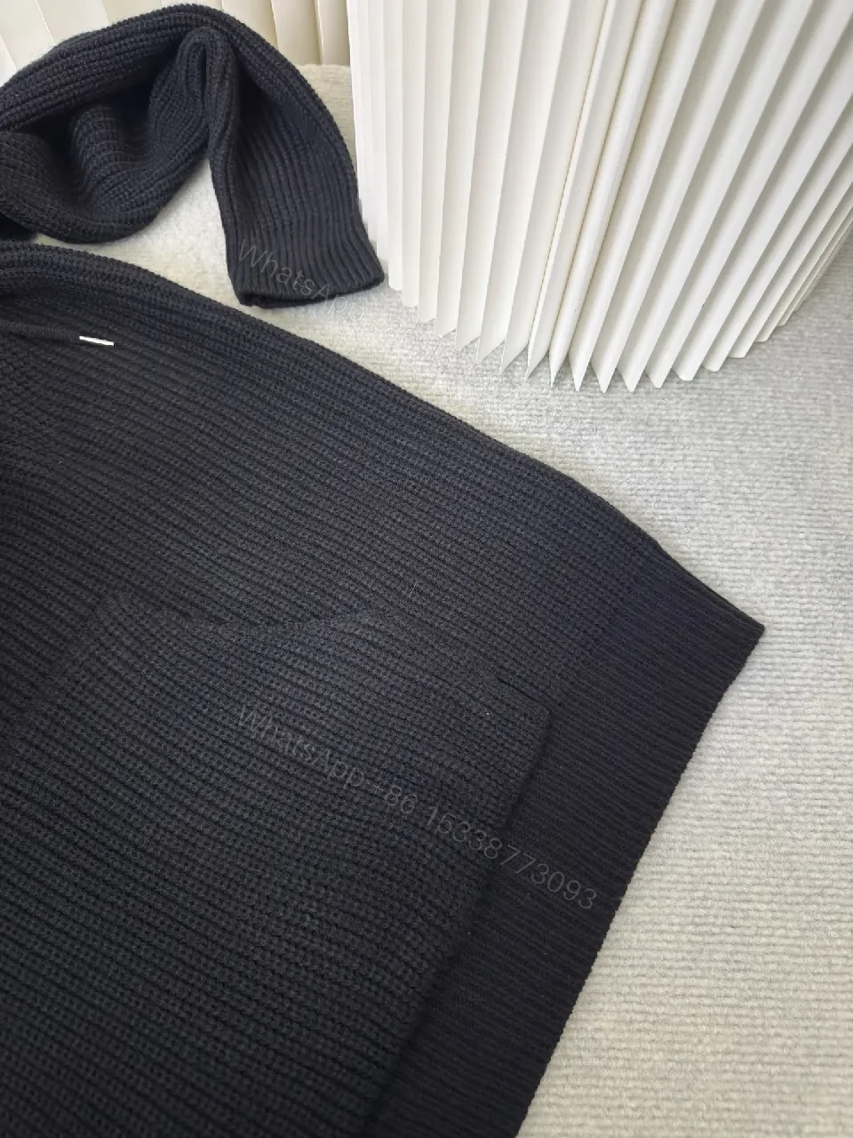 View 6 of Chunky Knit Hoodie in Deep Black with Subtle Logo Embossing, Modern Luxe