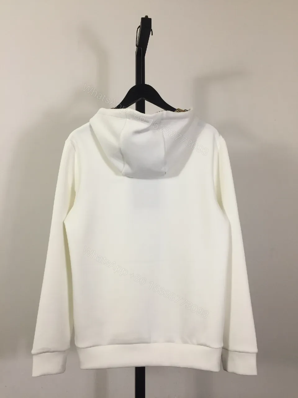View 5 of Minimalist Off-White Hoodie with Subtle Logo Design