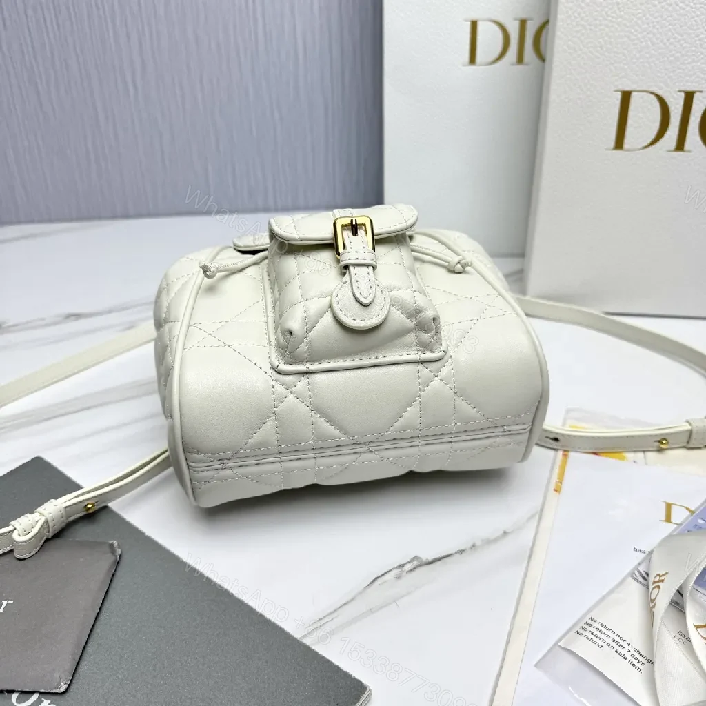 View 9 of Quilted White Mini Backpack with Gold Hardware - Compact Luxury