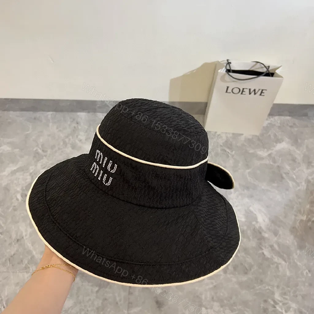 View 3 of Structured Black Straw Bucket Hat — Crystal Logo Accent, All-Season Style