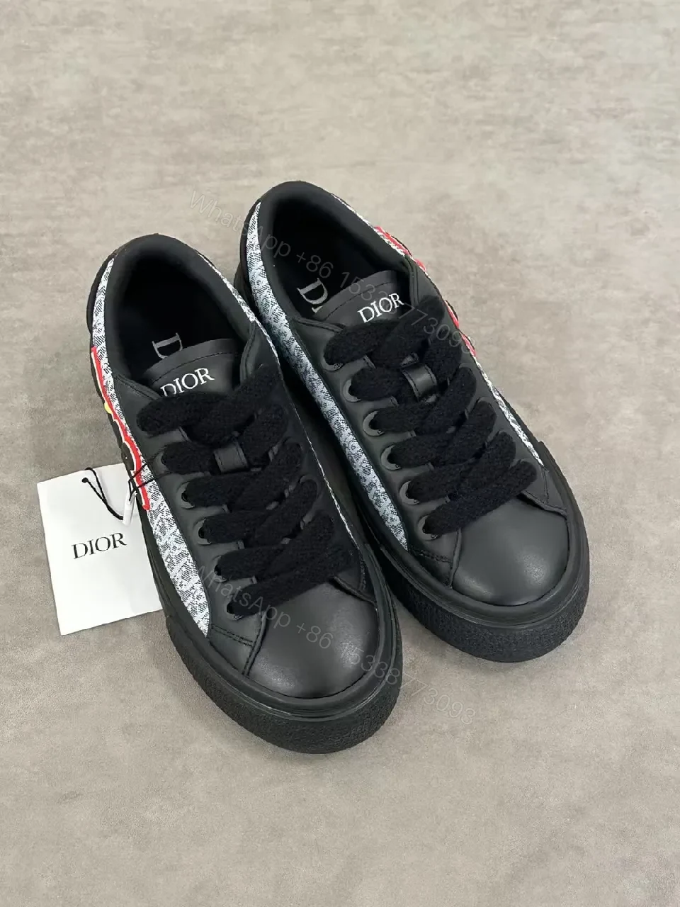 View 8 of Bold Leather High-Top Sneakers with Red Script Graphic