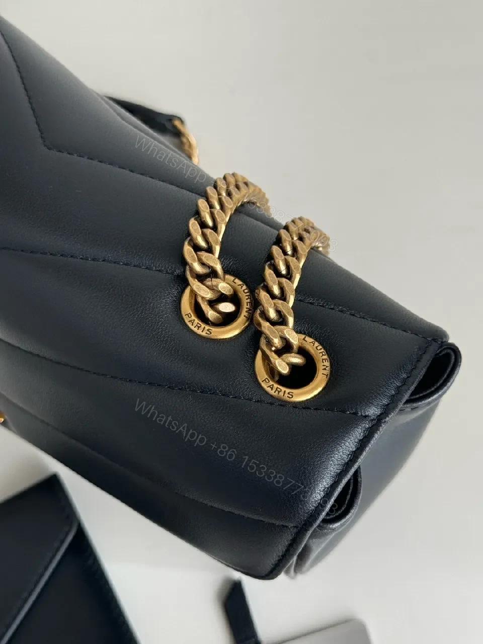 View 6 of Quilted Leather Crossbody Bag with Gold Emblem, Luxury Style