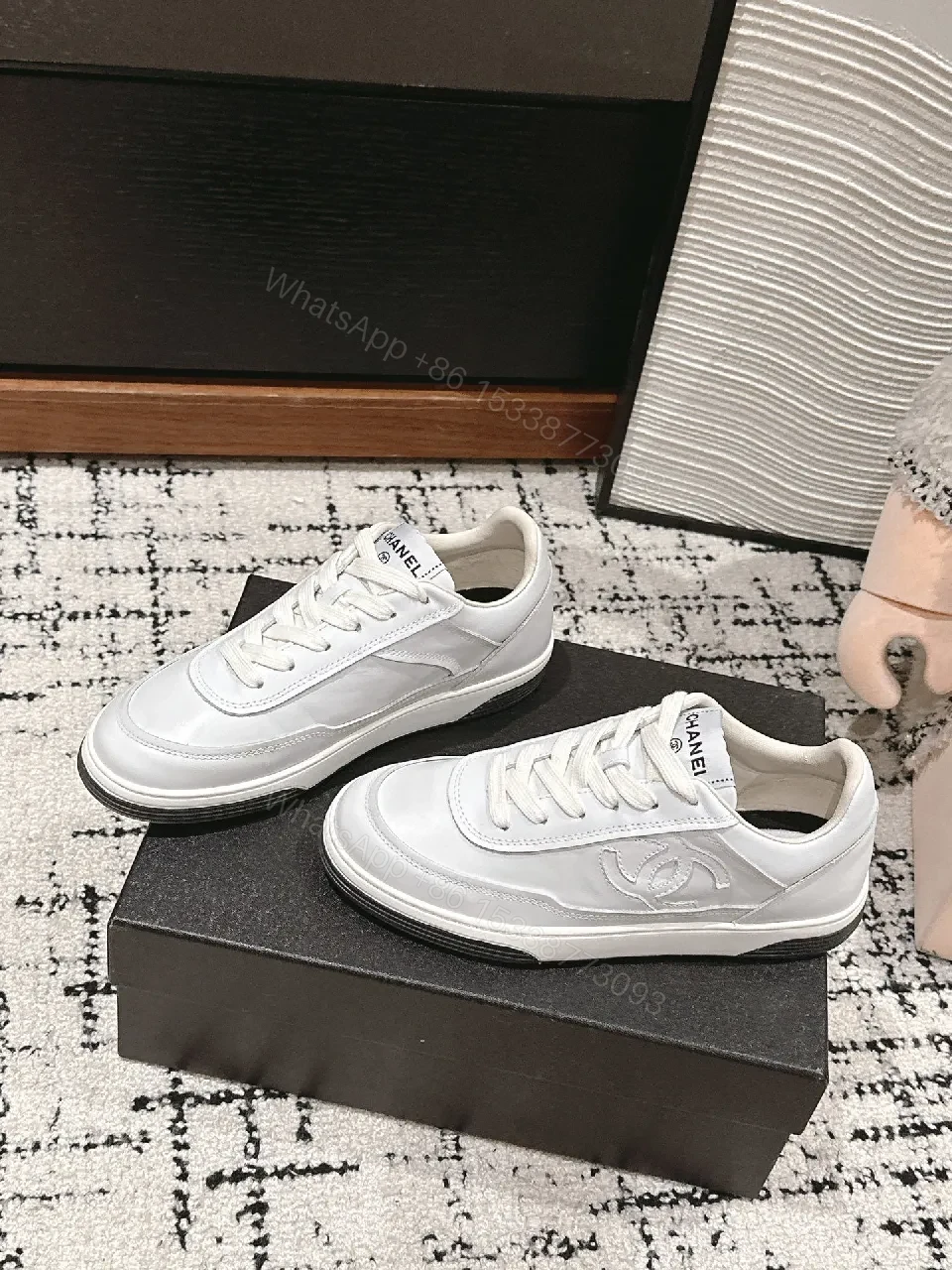 View 7 of Minimalist White Leather Sneakers with Subtle Chanel Detailing