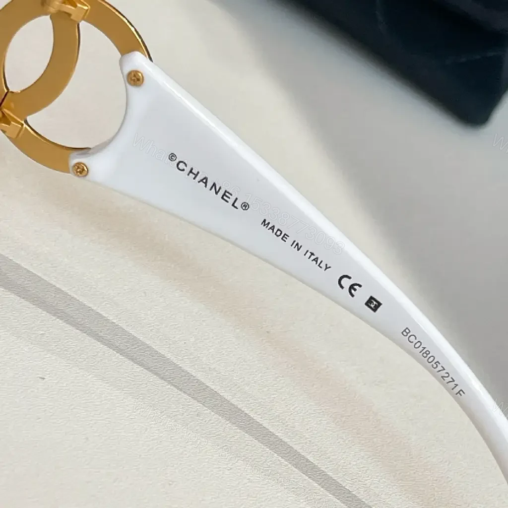 View 3 of Oversized Black Luxury Sunglasses with Gold Logo Details