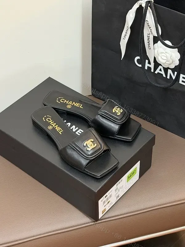 Black Leather Mules with Gold Logo Detail – Effortless Chic — view 1