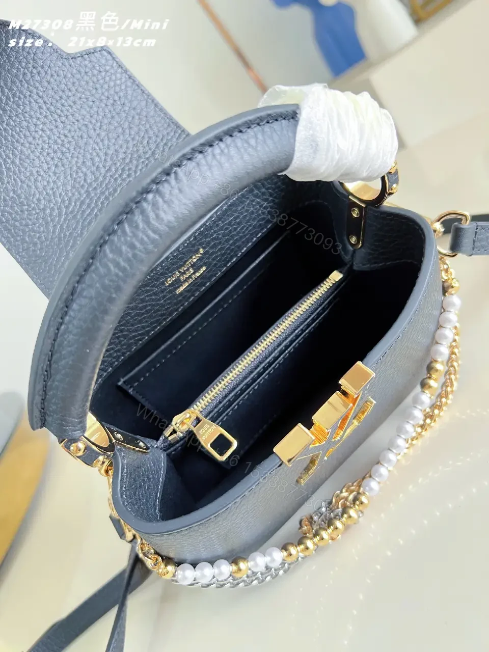 View 2 of Luxurious Mini Bag: Pebbled Leather, Layered Chains, Crossbody Embellishments