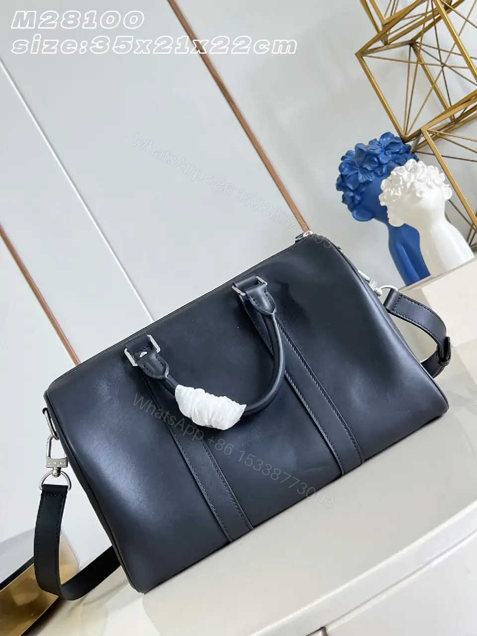 View 5 of Black leather structured satchel with top handle, removable strap, smooth finish, Louis Vuitton Paris (no brand details)