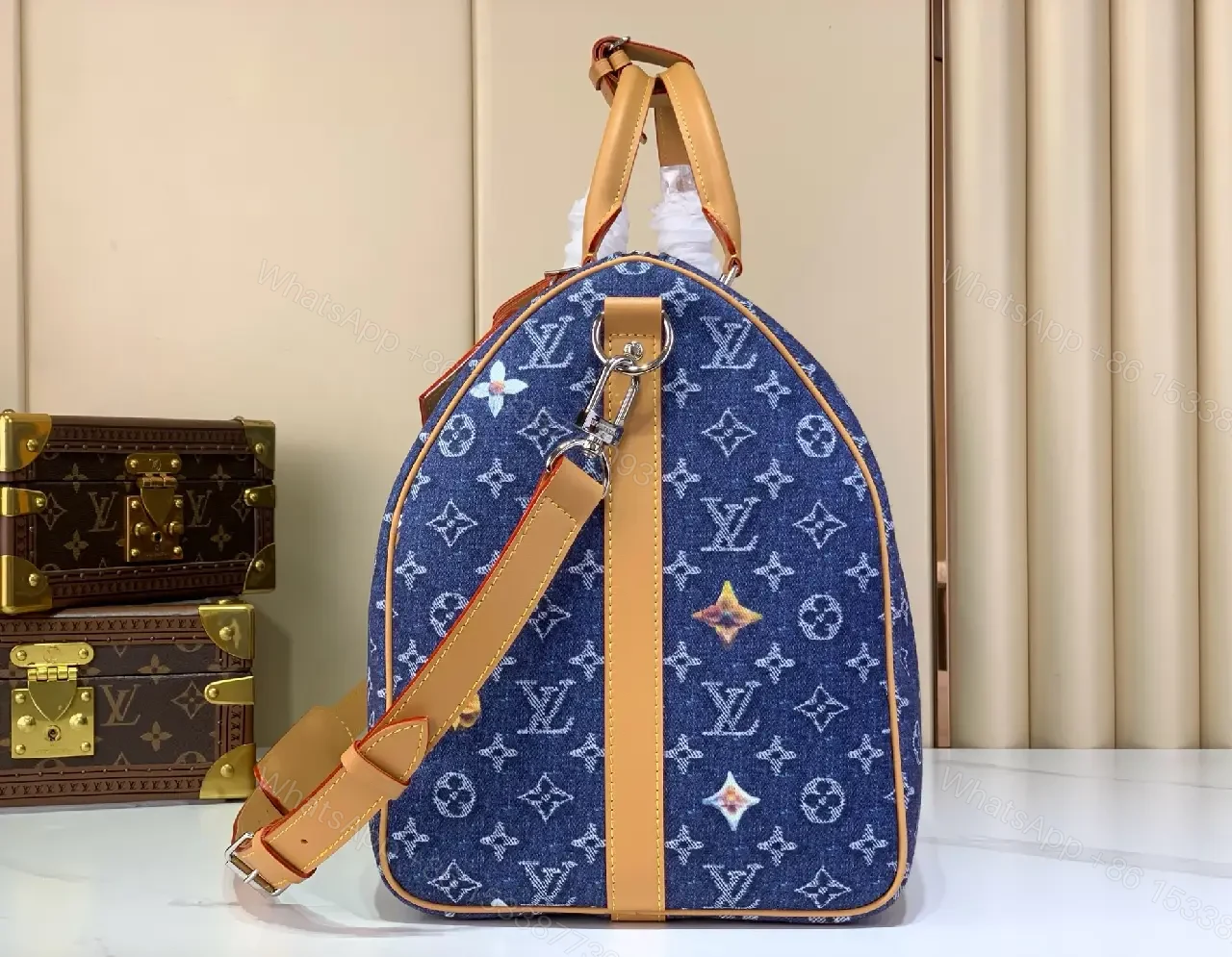 View 6 of Blue denim monogram-print travel bag with tan leather trim for luxury weekends