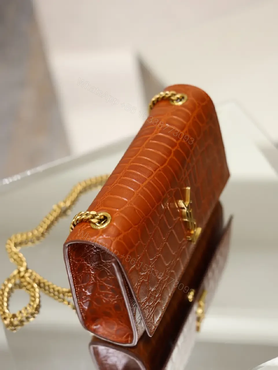 View 4 of Brown Crocodile-Embossed Leather Clutch with Gold Logo Clasp