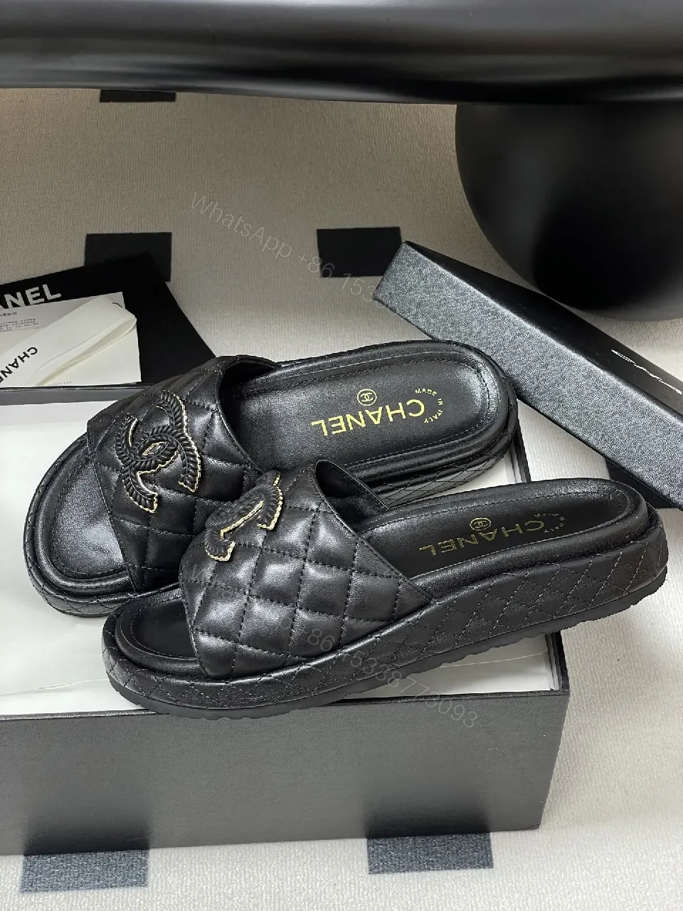 View 4 of Quilted Black Slip-Ons with Gold Emblem – Luxe Style