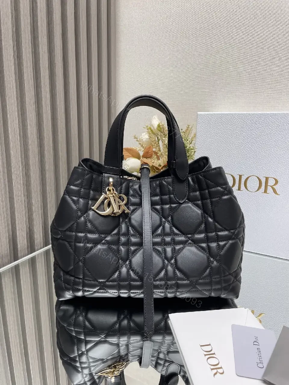 View 2 of Black Quilted Tote with Gold Charm – Luxury Everyday Bag