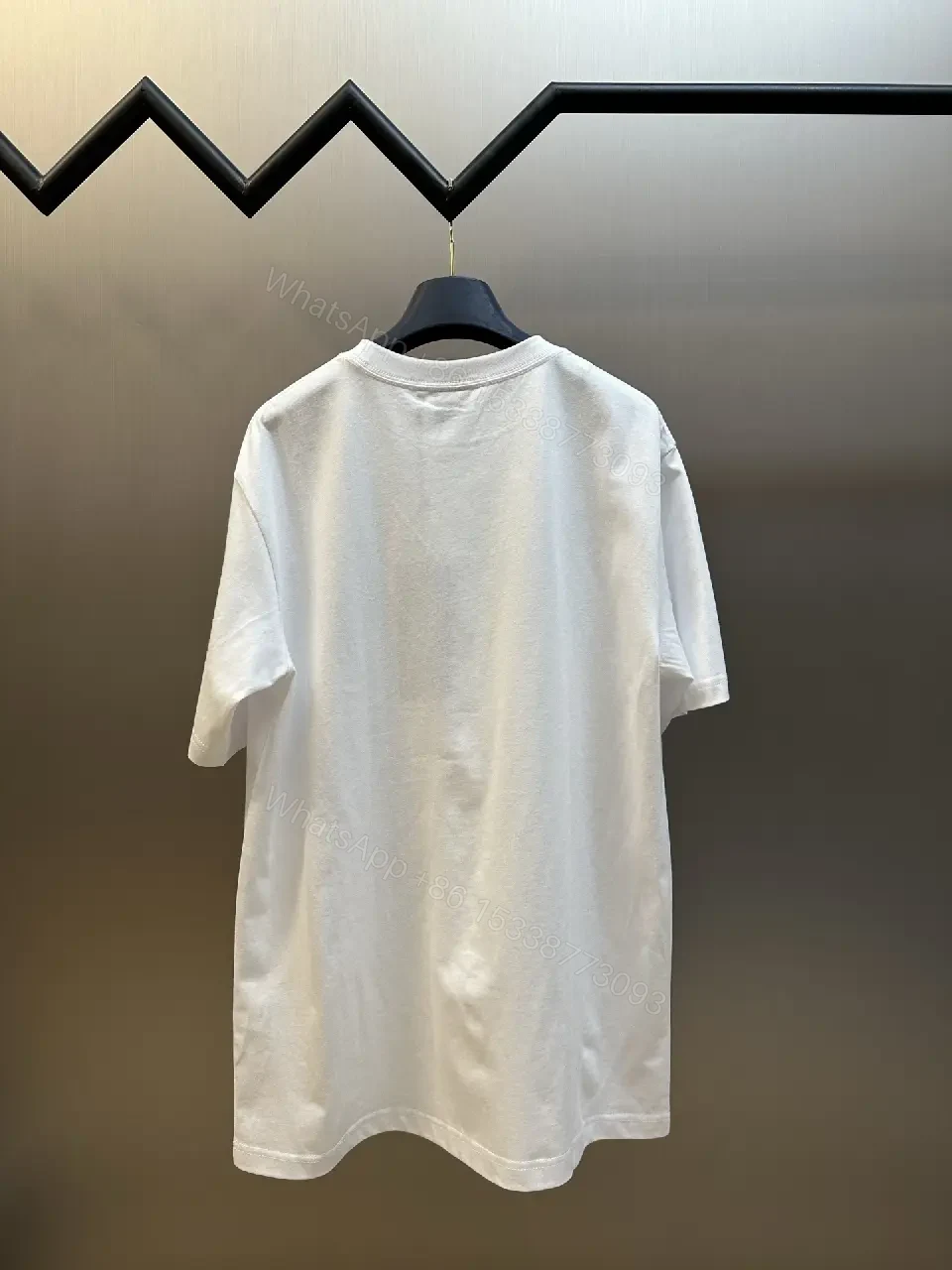 View 11 of Minimalist White Logo Tee - Premium Cotton, Modern Fit, Graphic Accent