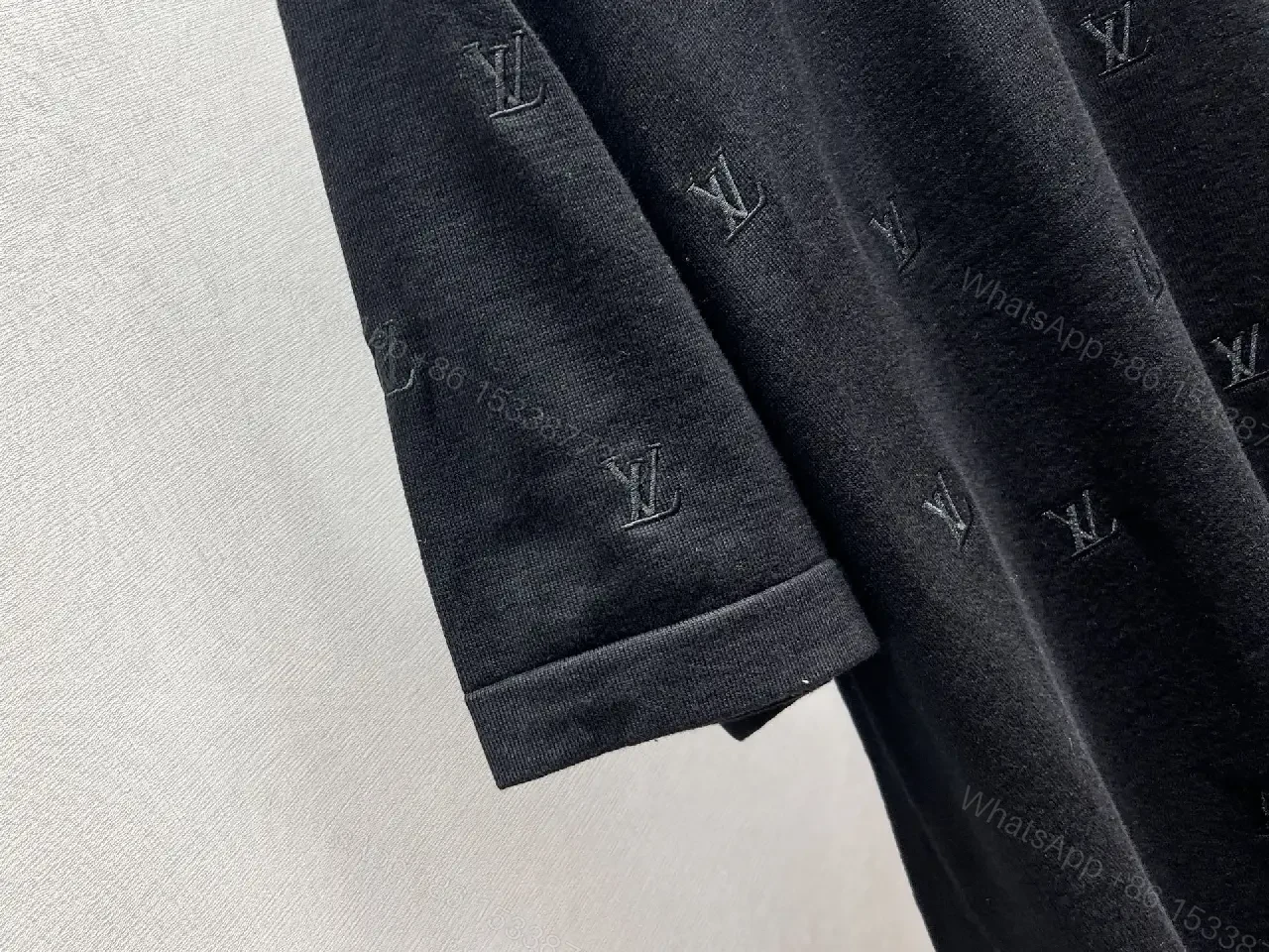 View 2 of Black Monogram Knit Tee: Subtle Texture, Everyday Luxury