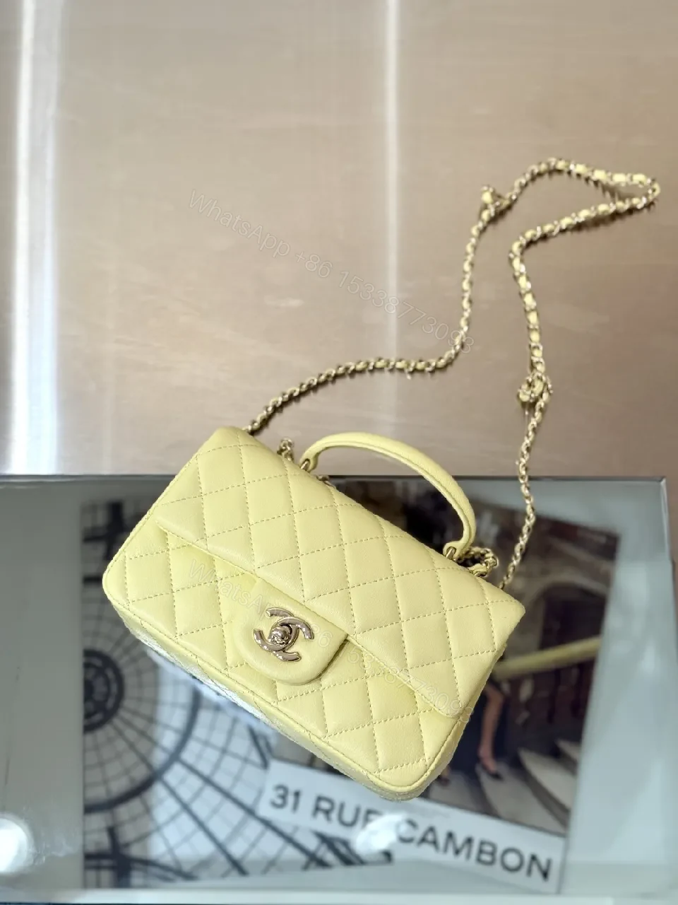 View 2 of Pale Leather Quilted Mini Bag with Chain Detail