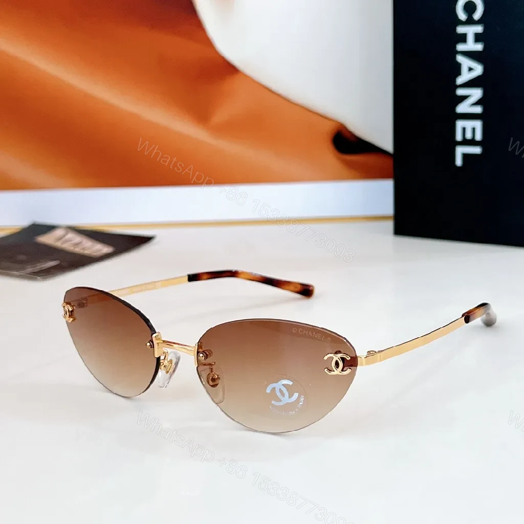 View 4 of Rimless Blue Lens Sunglasses with Gold-Tone Frames