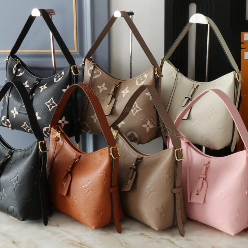 View 9 of Louis Vuitton Carryall PM Bicolor Monogram Empreinte Dove And Cream 29Cm M47180