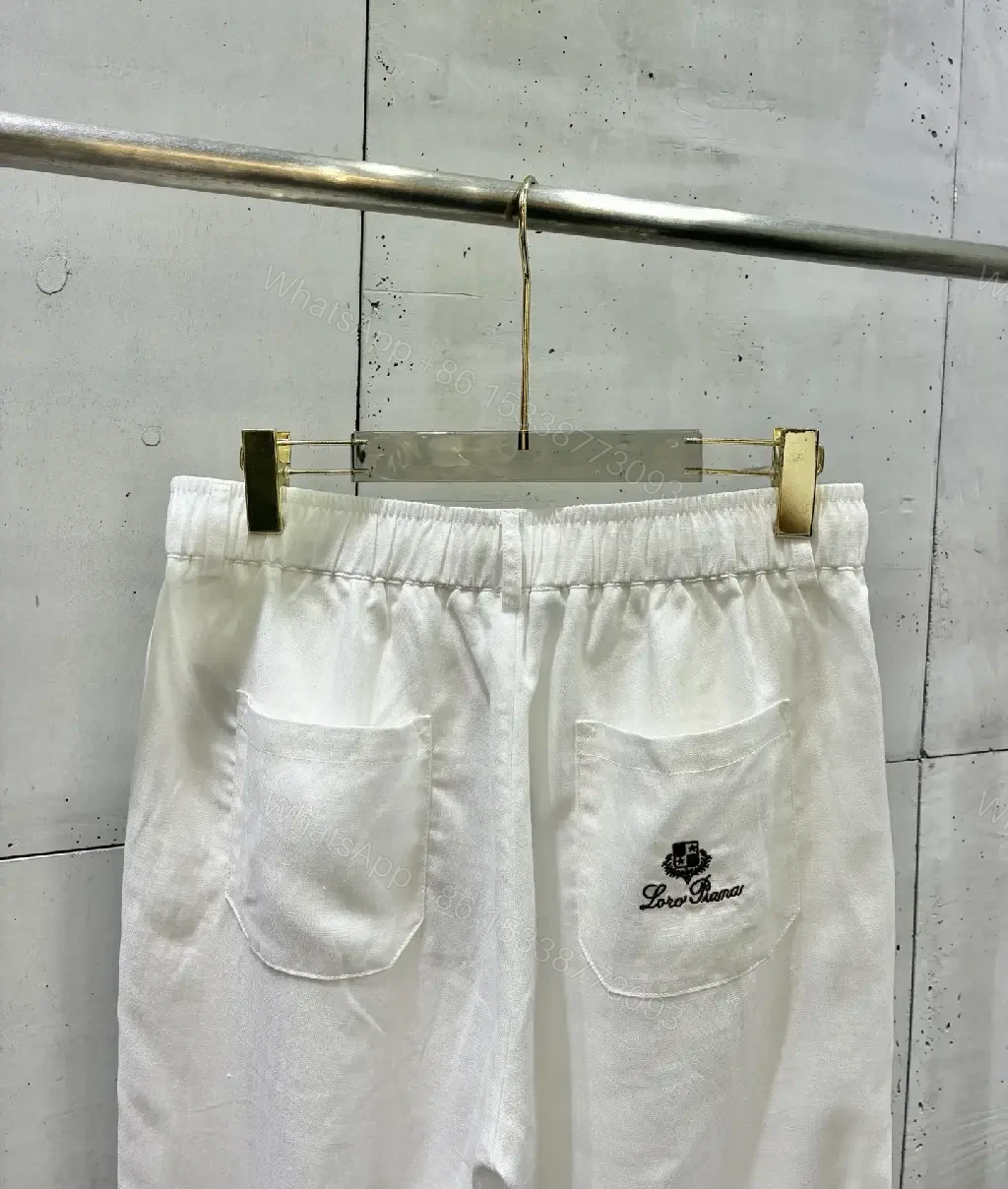 View 8 of Off-White Cream Wide-Leg Trousers with High Waist and Front Fly Closure