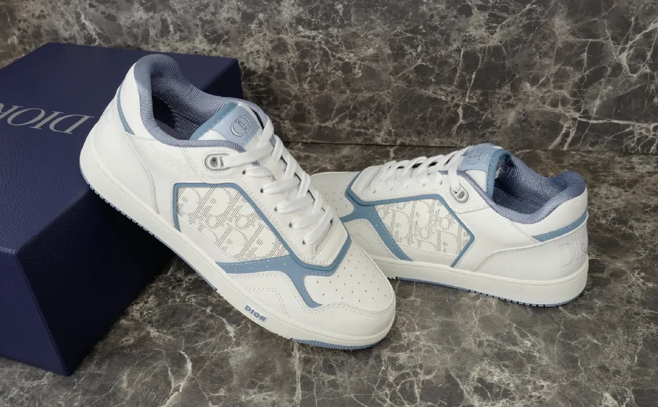 View 7 of Soft-White Leather Sneaker with Blue Accents and Signature Texture