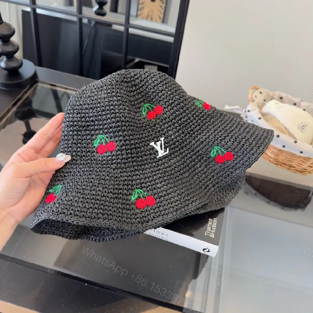 View 2 of Charcoal Crochet Bucket Hat with Cherry & LV Accent