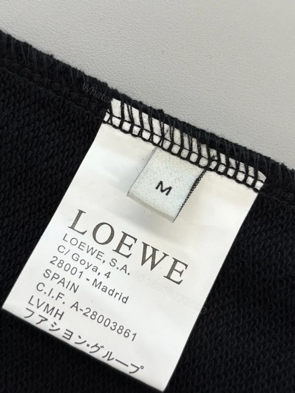 View 5 of Subtle Black Fleece Logo Sweatshirt, Luxe Casual