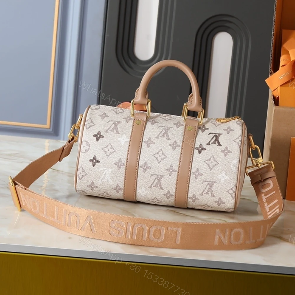 View 5 of Louis Vuitton Keepall Bandoulière 25 Monogram Beige 25Cm