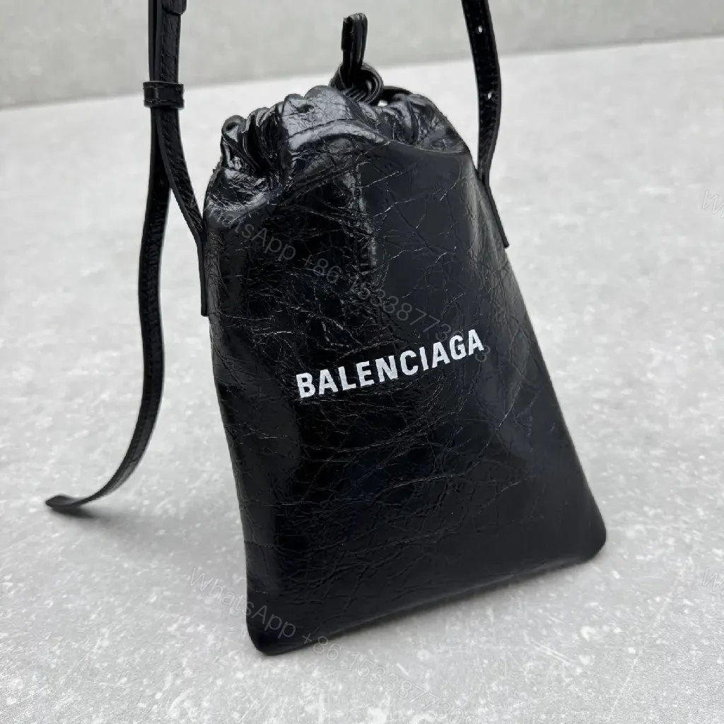 View 4 of Black Leather Drawstring Crossbody Bag - Minimalist Luxe Compact Carry