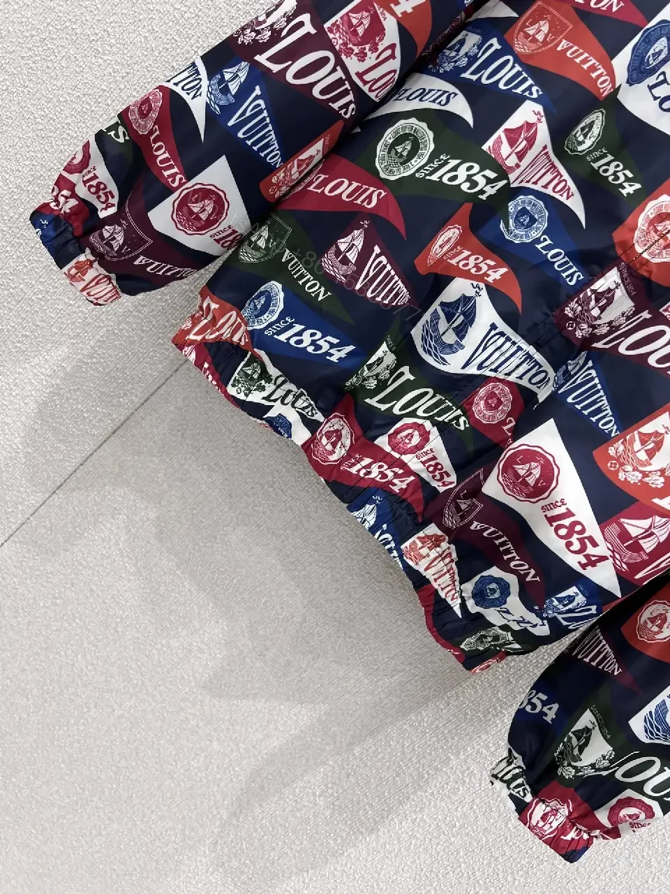 View 6 of Bold Patterned Zip Jacket: Logo Motif Luxury Streetwear