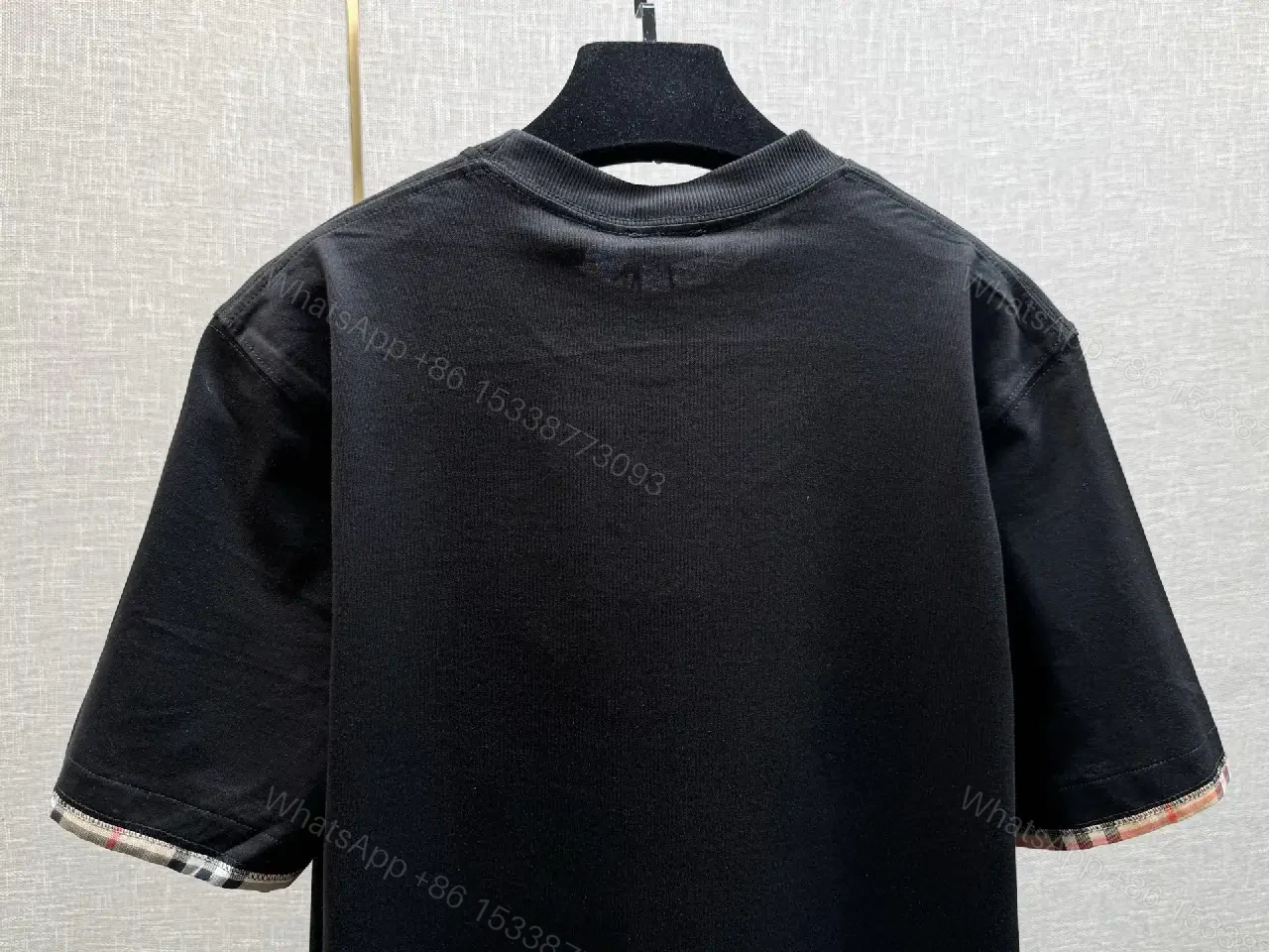 View 6 of Minimalist Black Cotton Tee with Plaid Sleeve Trim