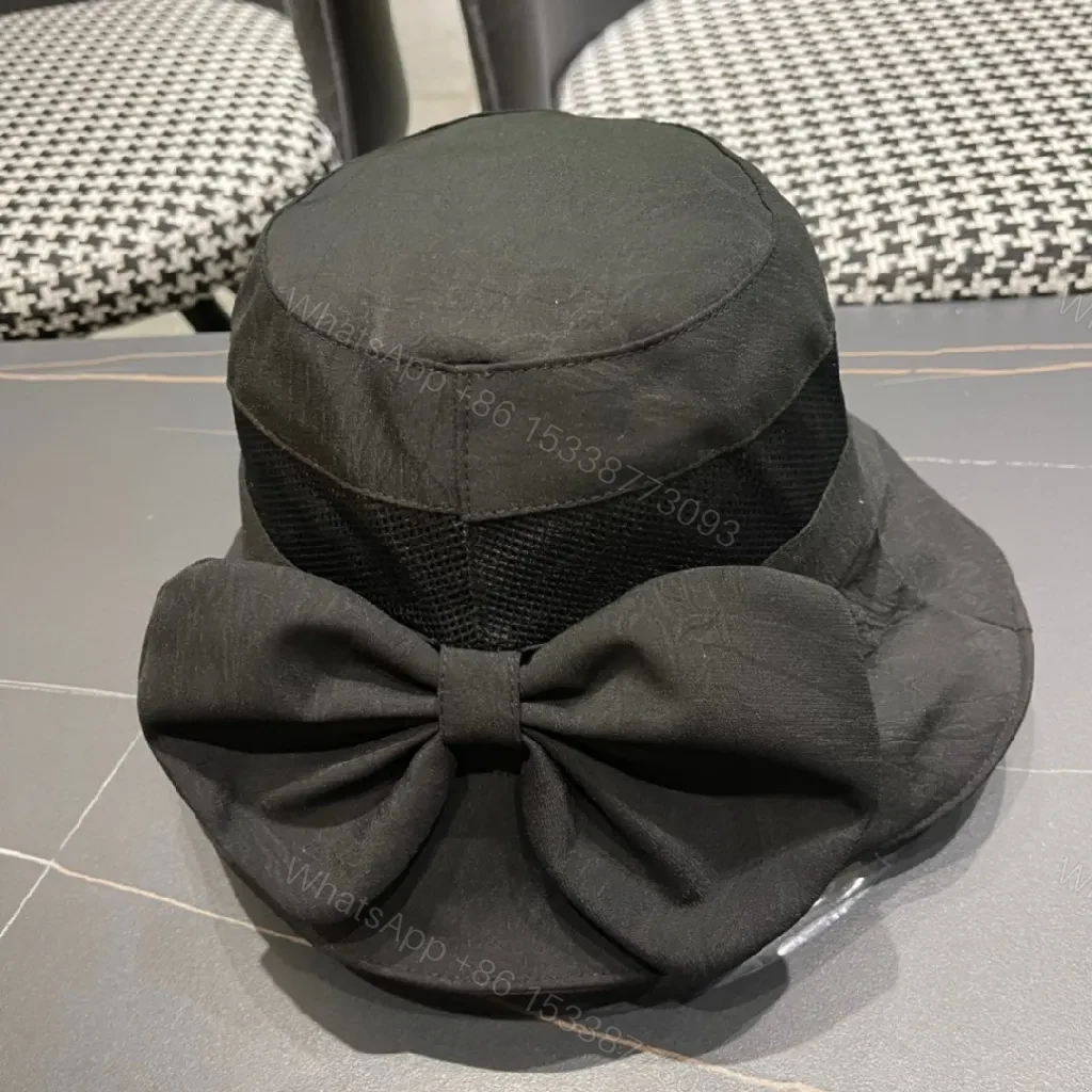 View 10 of Minimalist Black Bucket Hat with Discreet Luxe Label