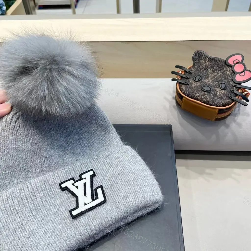 View 9 of Cozy Gray Knit Beanie with LV Emblem Accent